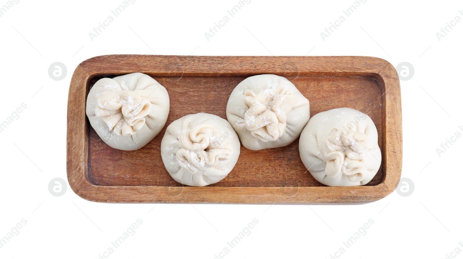 Photo of Tray with uncooked khinkali (dumplings) isolated on white, top view. Georgian cuisine