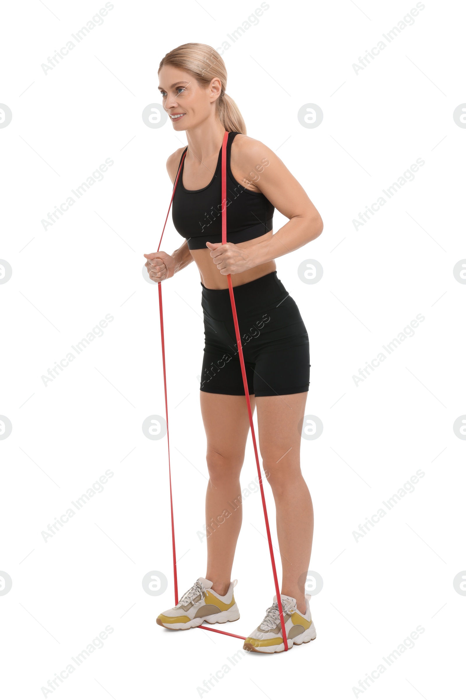 Photo of Woman exercising with elastic resistance band on white background