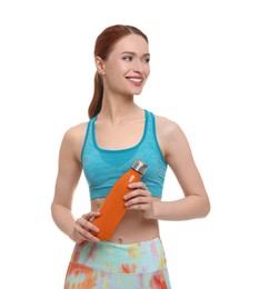 Photo of Young woman in sportswear with thermo bottle on white background