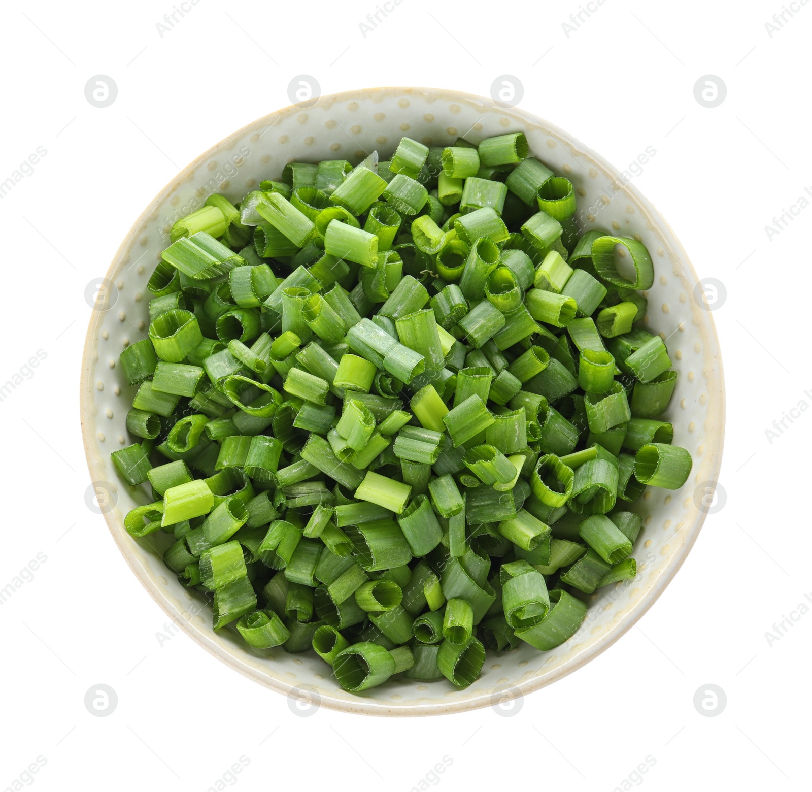 Photo of Bowl of cut green onion on white background, top view