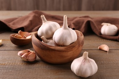 Fresh garlic on wooden table, closeup view