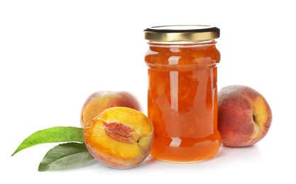 Jar with peach jam and fresh fruit on white background