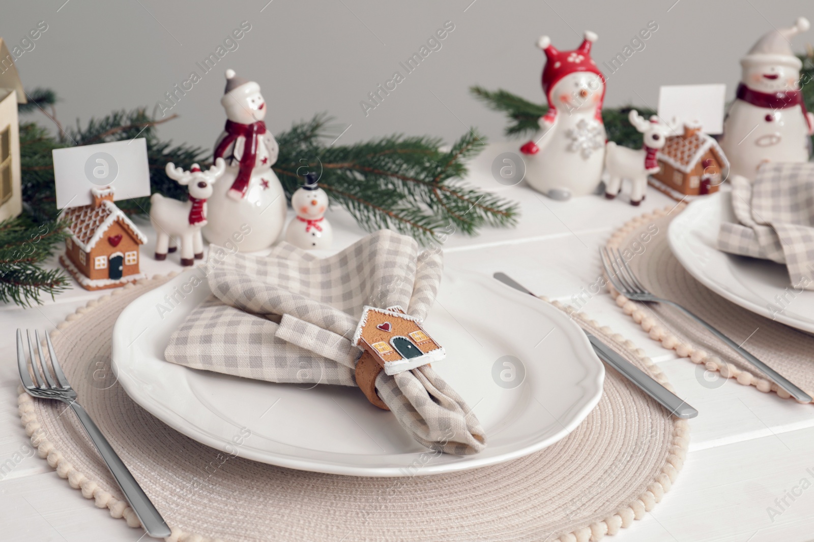 Photo of Luxury place setting with beautiful festive decor for Christmas dinner on white table