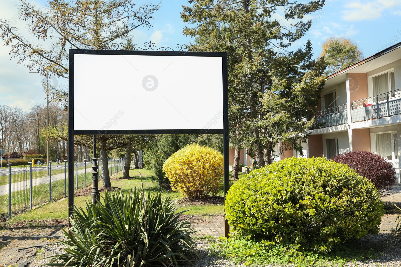 Image of Empty signboard outdoors on sunny day. Mock-up for design