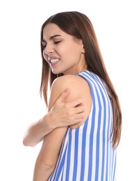 Photo of Young woman scratching shoulder on white background. Annoying itch