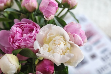 Photo of Bouquet of beautiful peonies on blurred background, closeup. Space for text