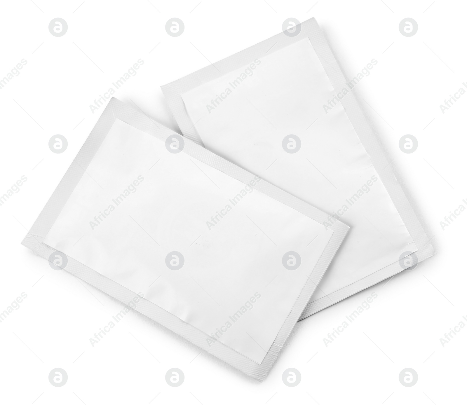 Photo of Two blank medicine sachets on white background, top view