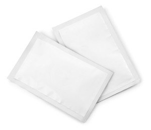 Two blank medicine sachets on white background, top view