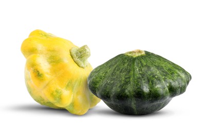 Fresh yellow and green pattypan squashes on white background