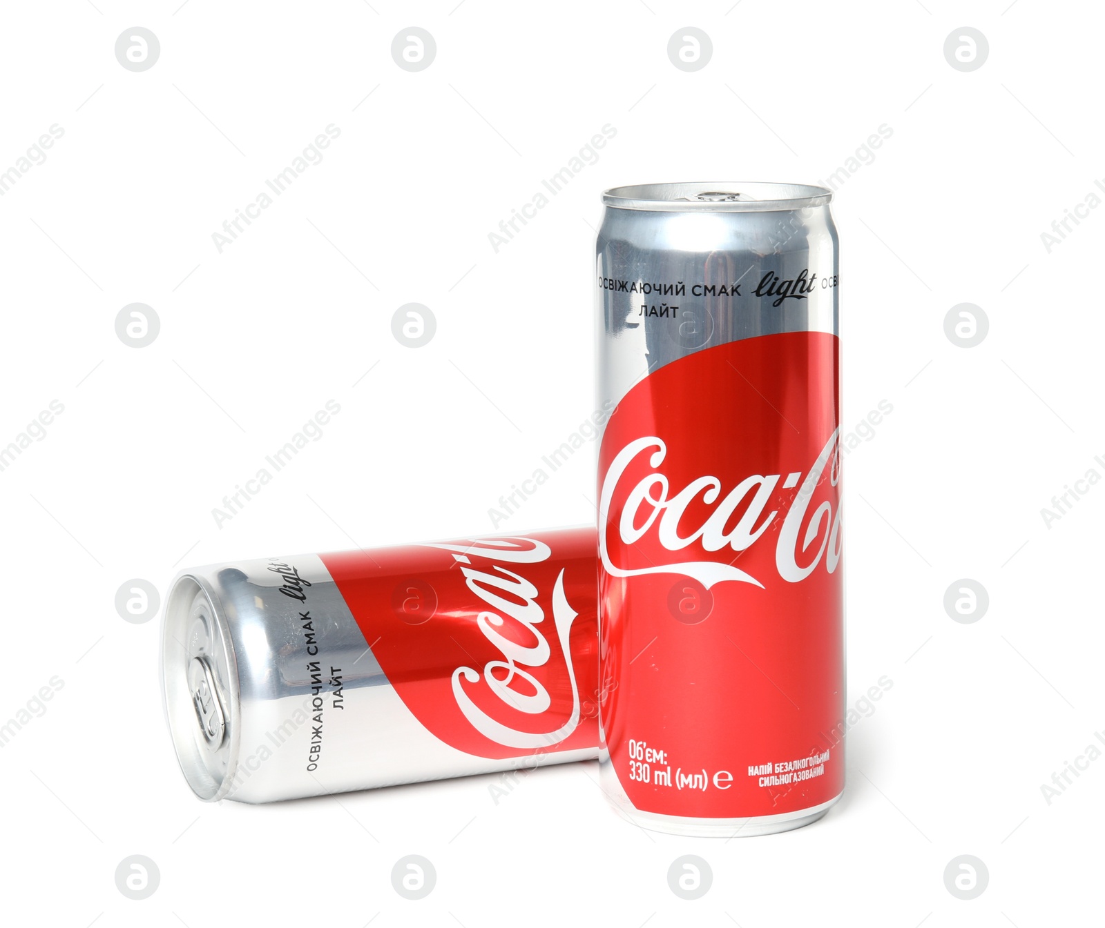 Photo of MYKOLAIV, UKRAINE - NOVEMBER 14, 2018: Coca-Cola cans on white background