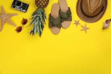 Photo of Flat lay composition with beach objects on yellow background, space for text