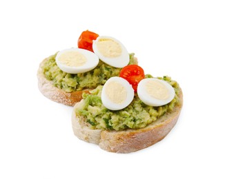 Delicious sandwiches with guacamole, eggs and tomatoes on white background