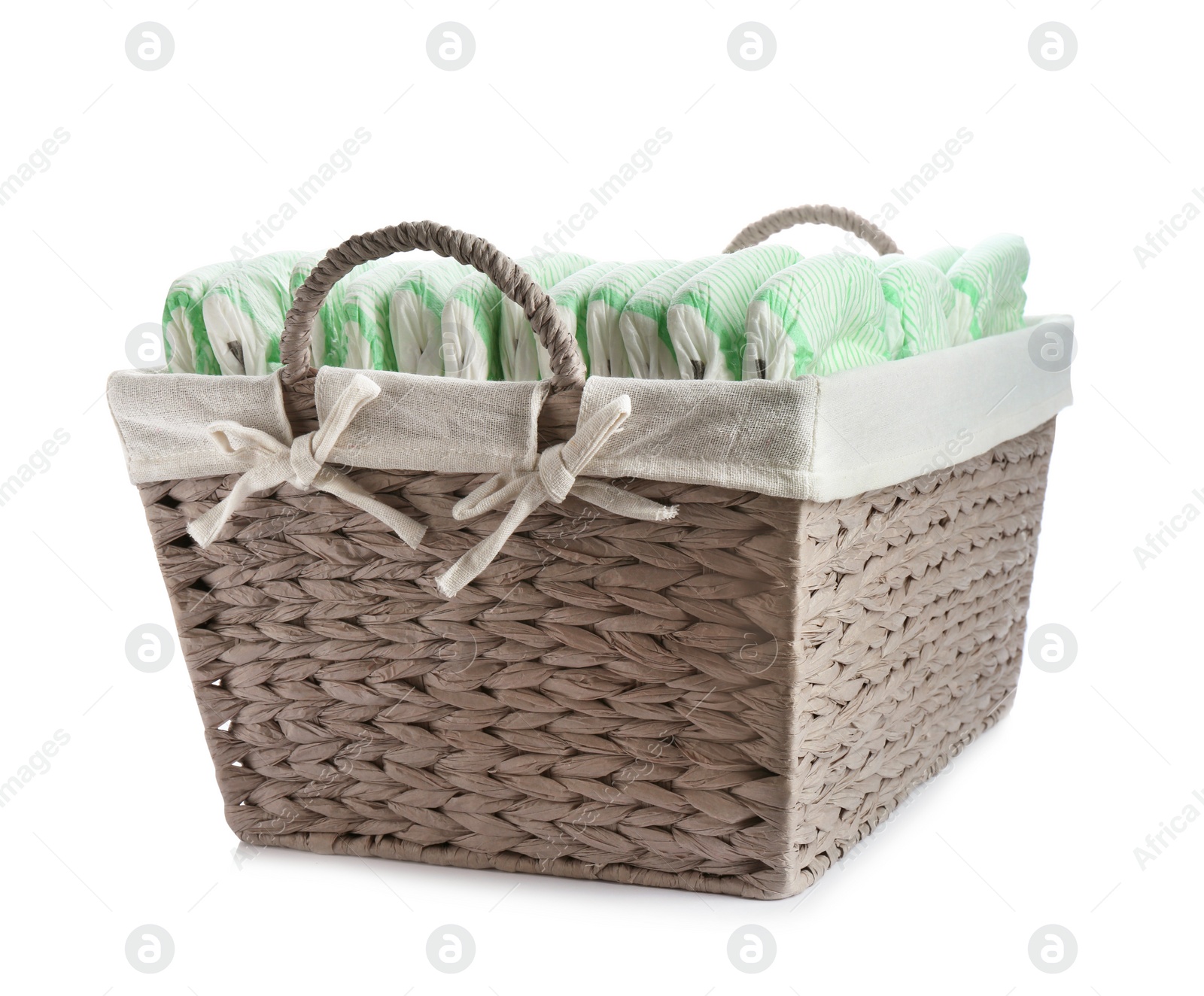 Photo of Basket with diapers on white background. Baby accessories