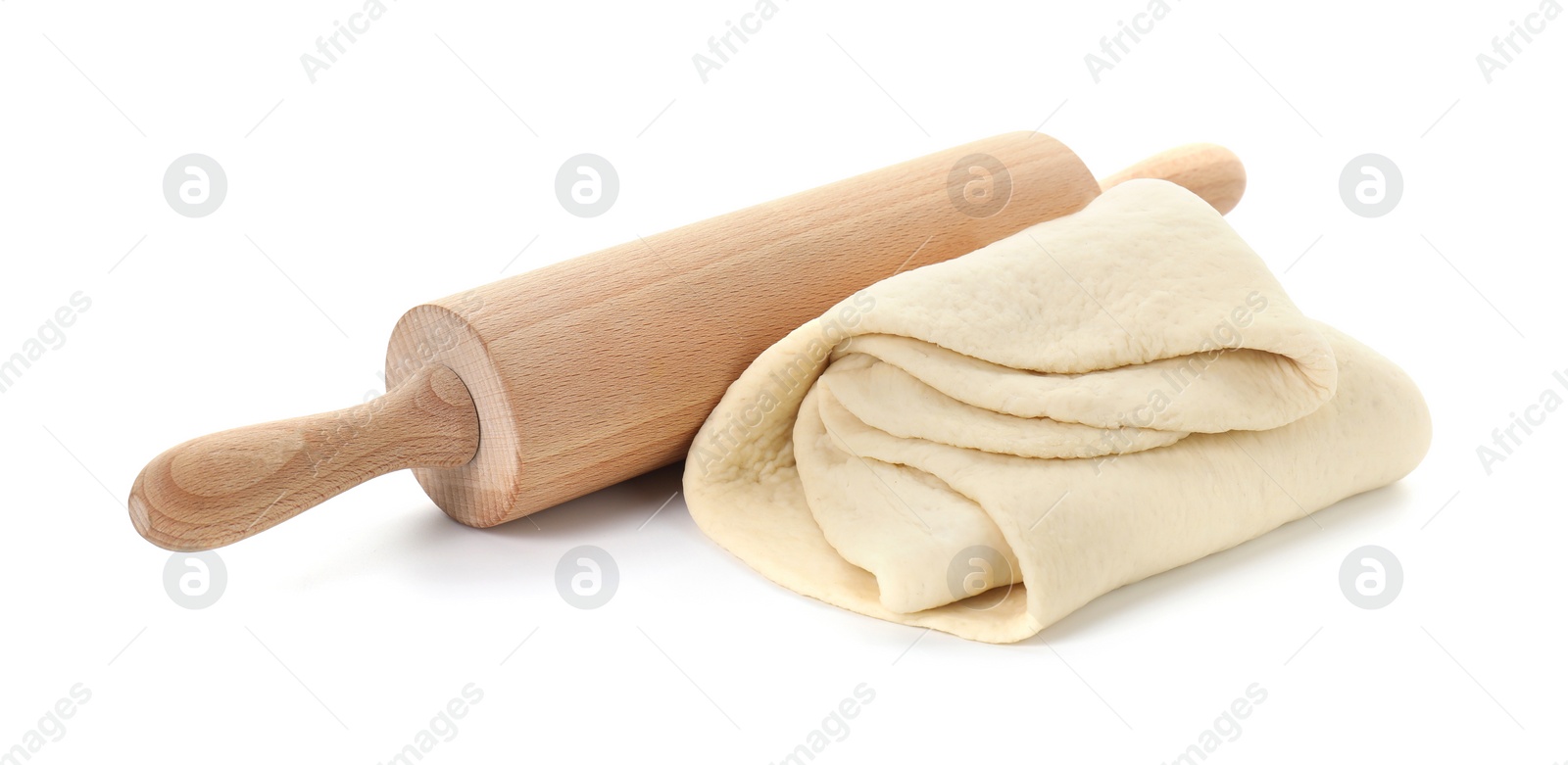 Photo of Raw dough and rolling pin isolated on white