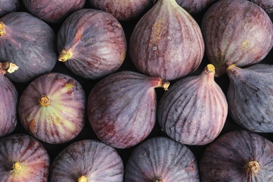 Photo of Many whole fresh purple figs as background, top view