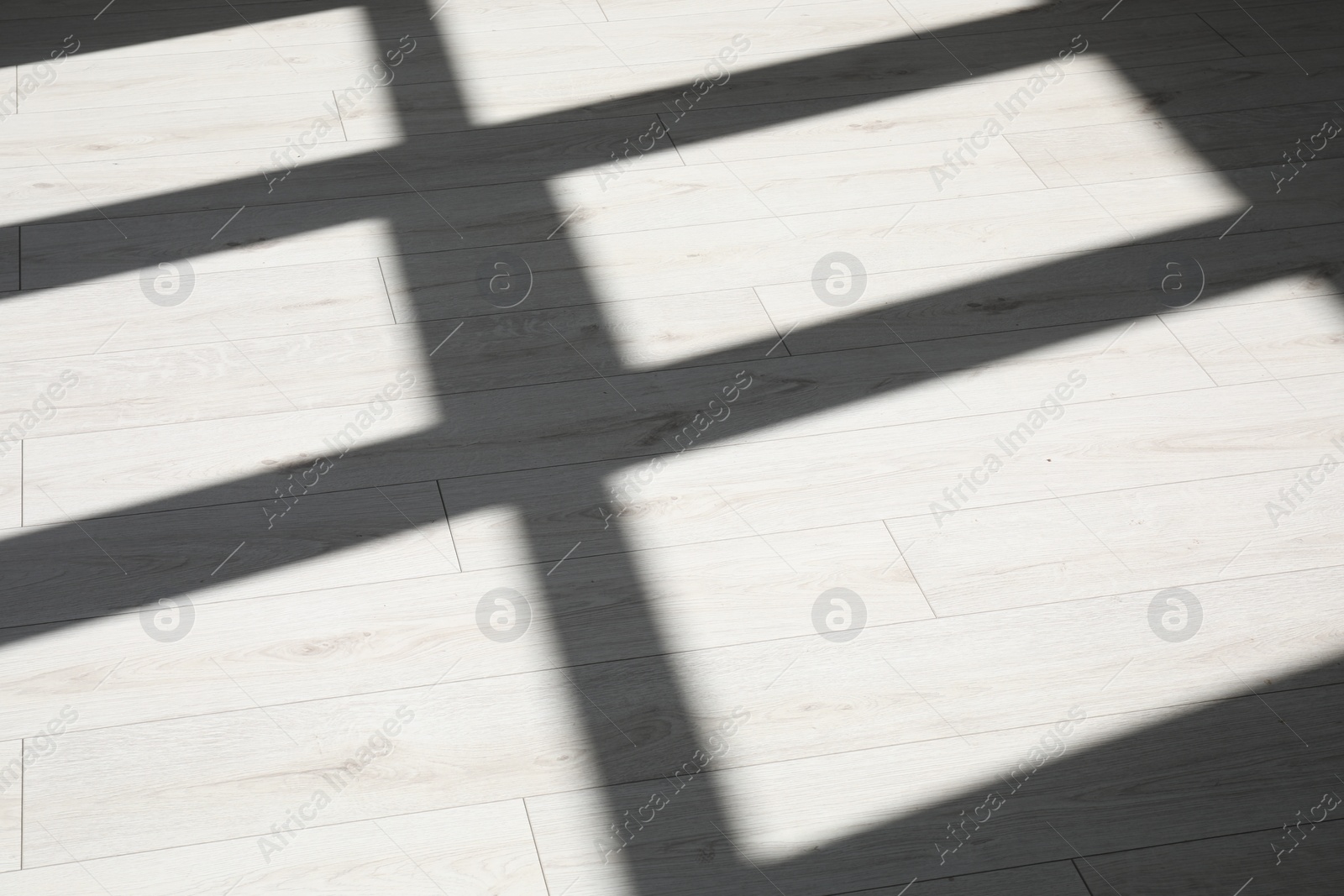 Photo of Shadow from window on white laminated floor indoors