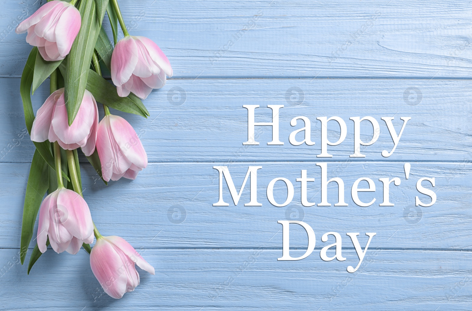 Image of Happy Mother's Day. Beautiful tulips on light blue wooden background, flat lay