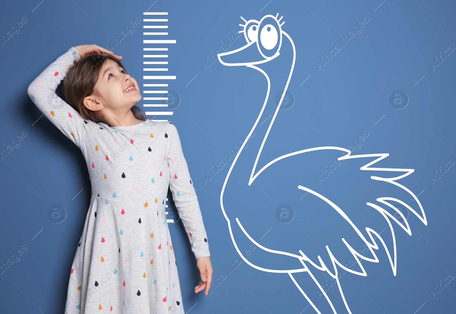 Image of Little girl measuring height and drawing of ostrich on blue background