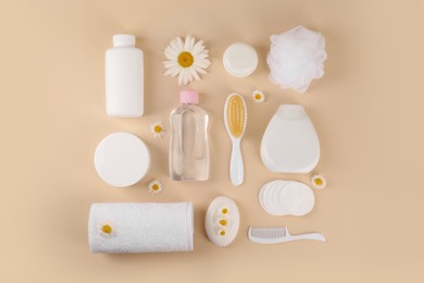 Photo of Flat lay composition with baby care products and accessories on beige background