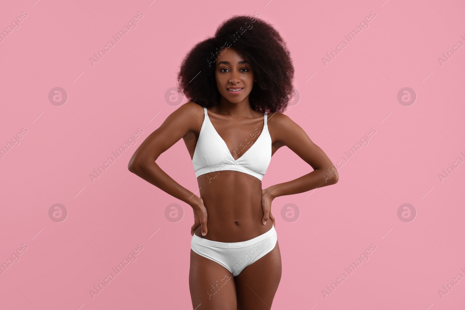 Photo of Beautiful woman in stylish bikini on pink background
