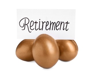 Photo of Many golden eggs and card with word Retirement on white background. Pension concept