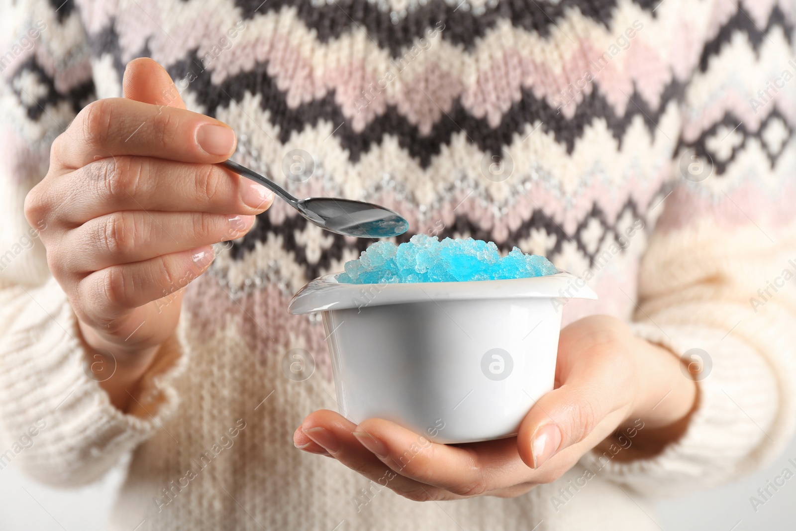 Photo of Woman eating tasty snow ice cream dessert, closeup