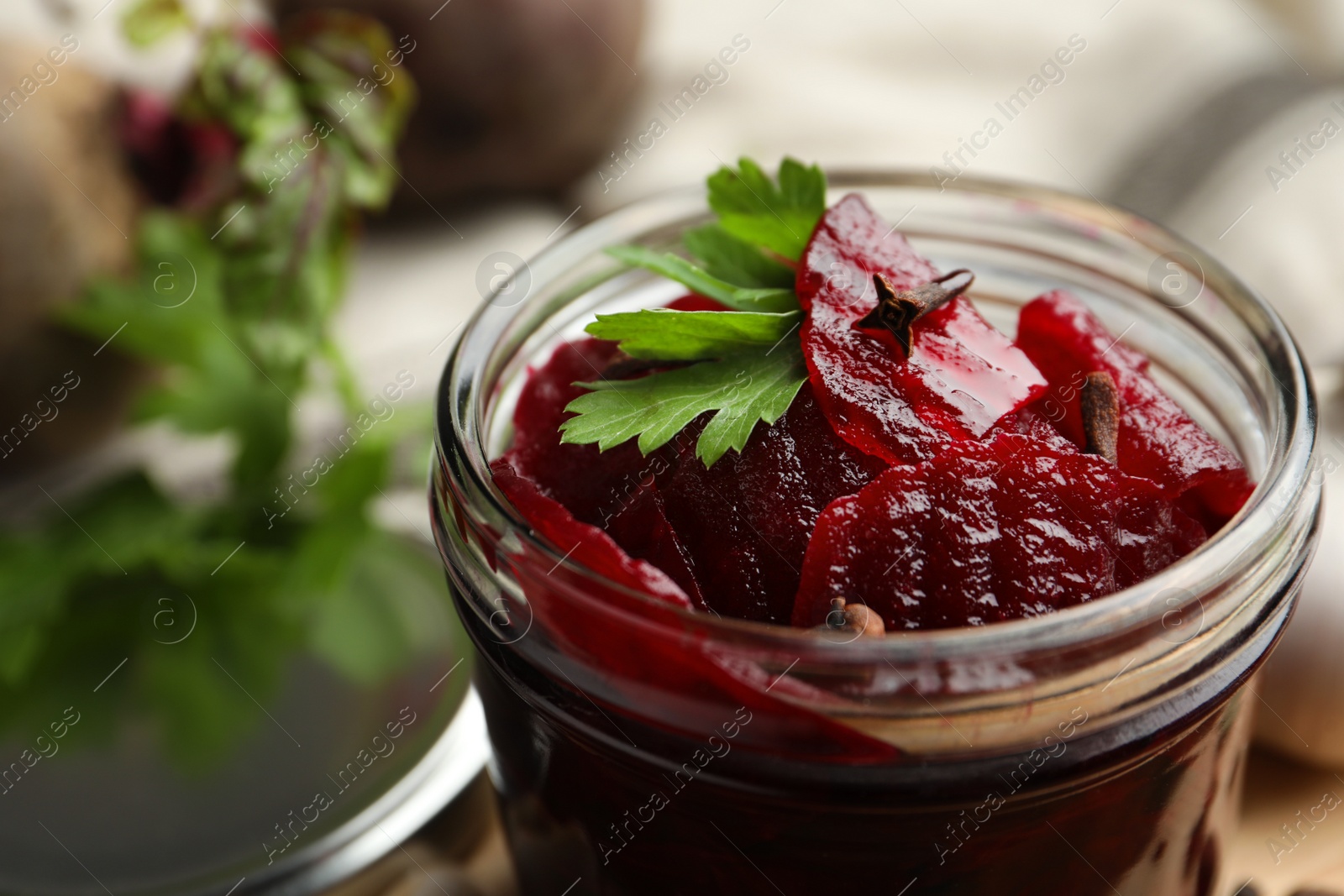 Photo of Delicious pickled beets in jar, closeup view