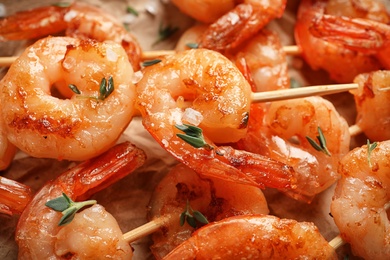 Skewers with delicious fried shrimps, closeup