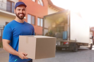 Image of Happy courier with parcel outdoors, space for text