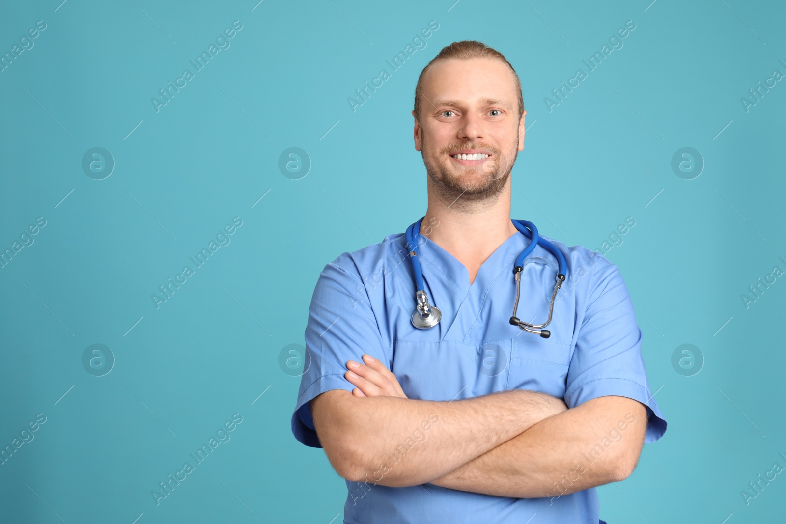 Photo of Portrait of medical assistant with stethoscope on color background. Space for text