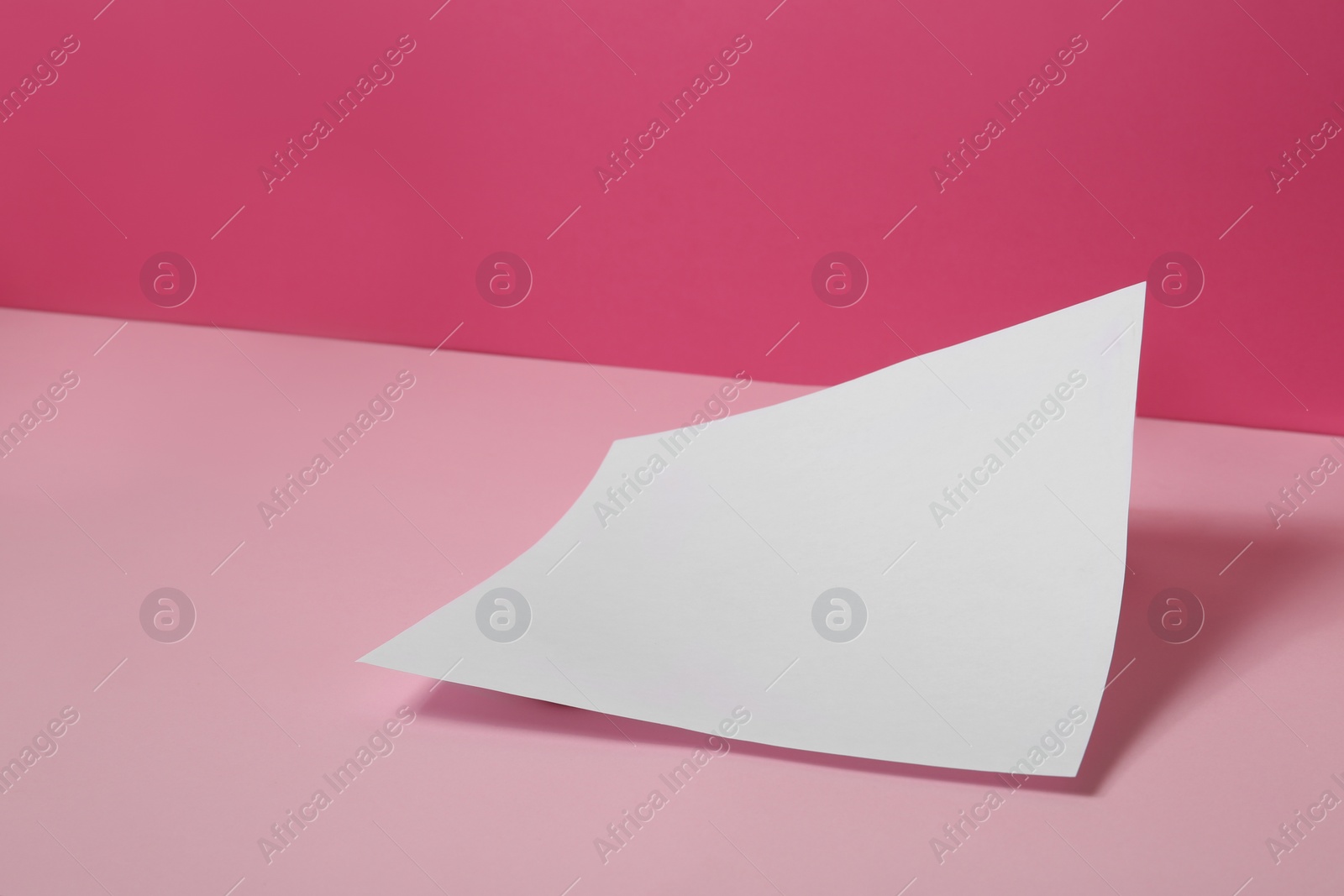 Photo of Empty sheet on color background. Mockup for design