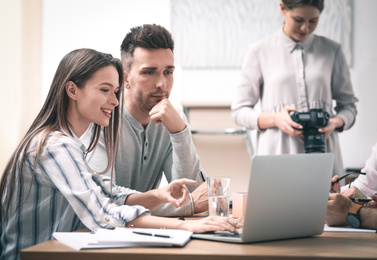 Team of professional journalists working in office