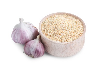 Photo of Dehydrated garlic granules in bowl and fresh bulbs isolated on white