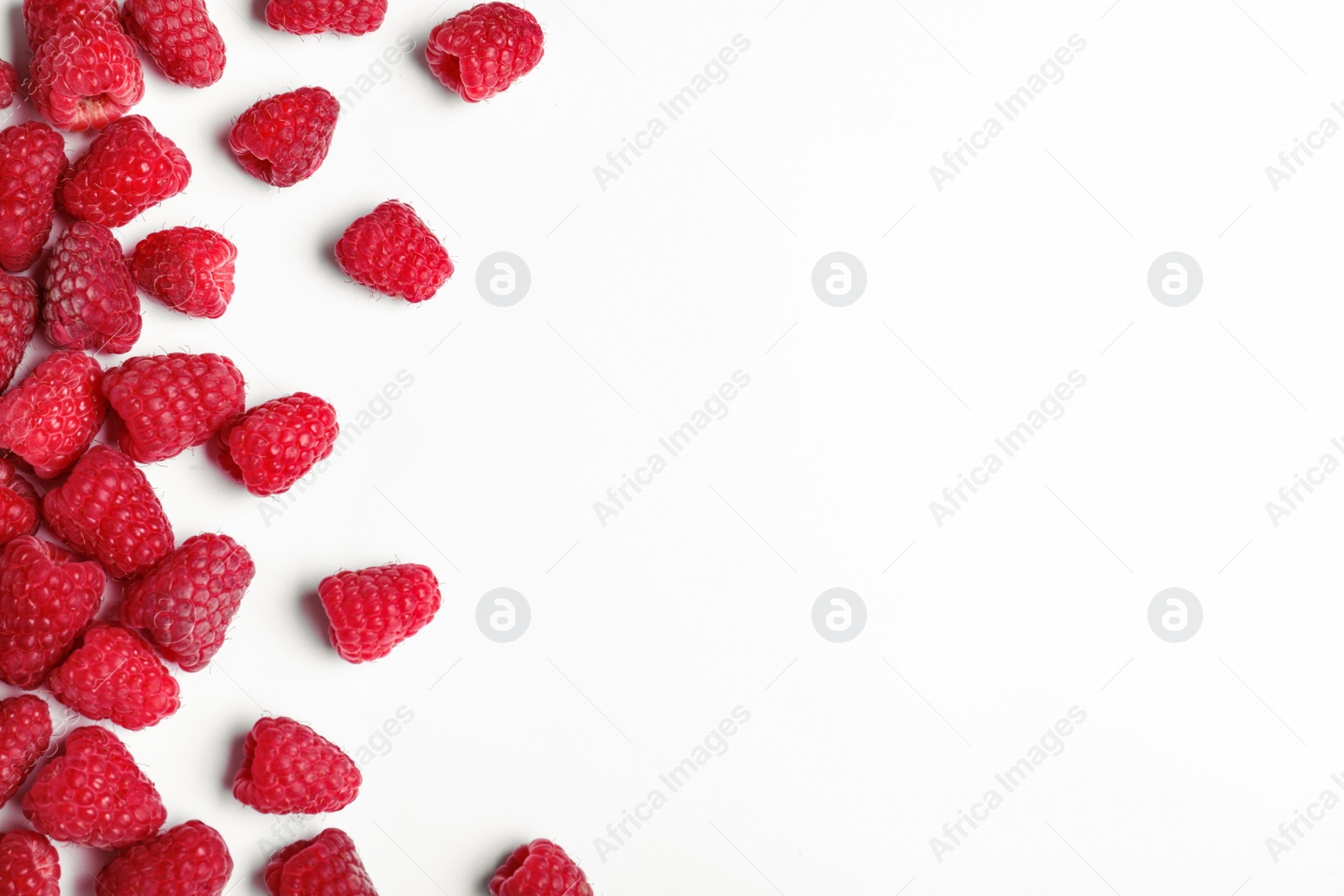 Photo of Composition with delicious ripe raspberries on white background, top view