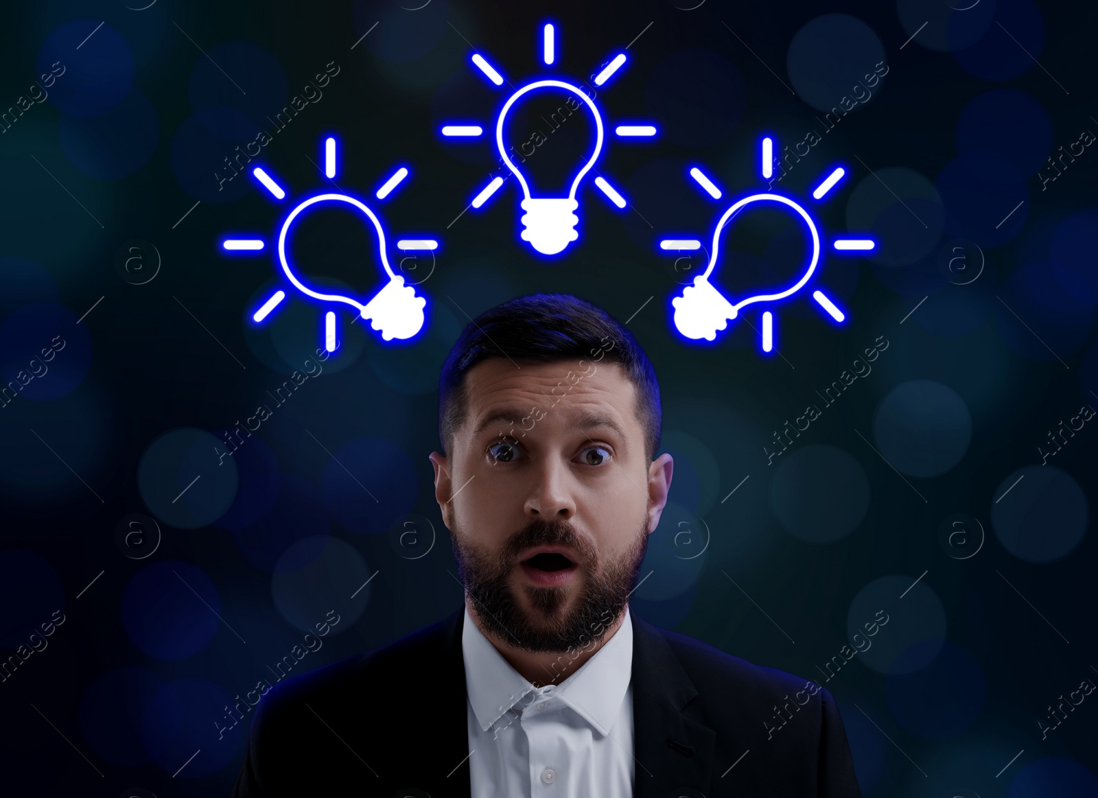 Image of Idea generation. Man on dark background. Illustrations of light bulb over him