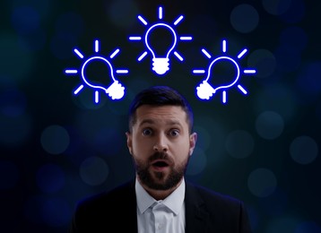 Idea generation. Man on dark background. Illustrations of light bulb over him