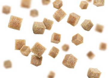 Image of Brown cane sugar cubes falling on white background