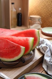 Photo of Sliced fresh juicy watermelon on wooden table, closeup