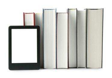 Photo of Hardcover books and modern e-book isolated on white