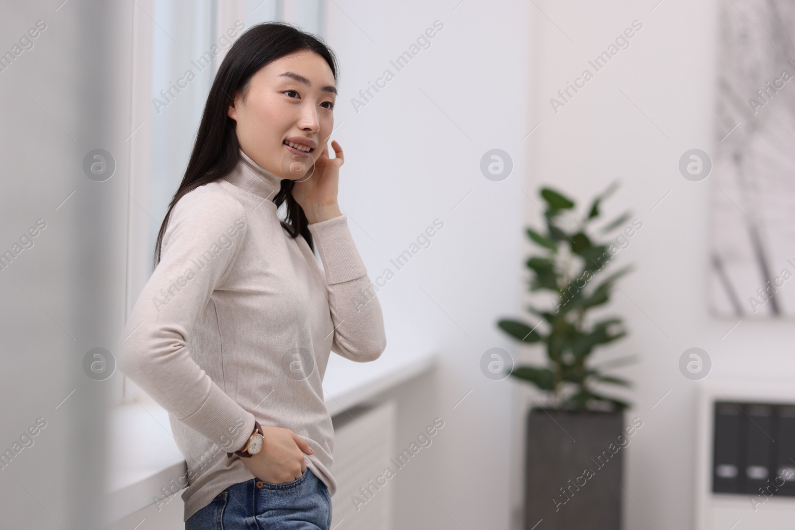 Photo of Portrait of smiling businesswoman in office. Space for text