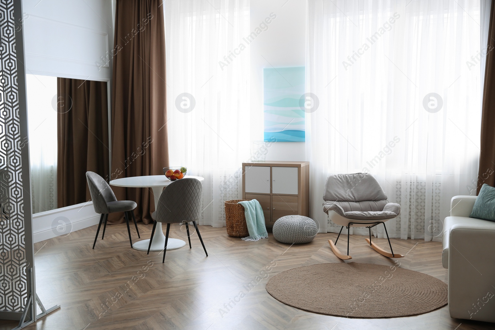 Photo of Modern living room with parquet floor and stylish furniture