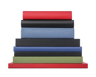 Stack of different hardcover books on white background