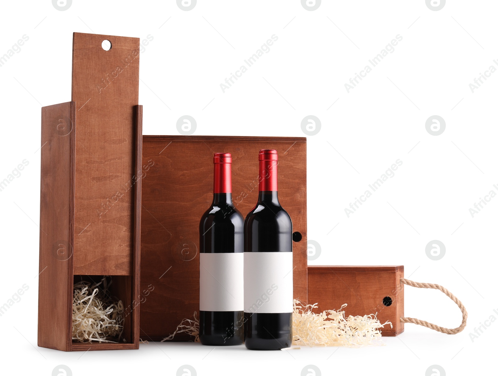 Photo of Wooden gift boxes with wine bottles isolated on white