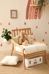 Photo of Child's room interior with rainbow painting on wall