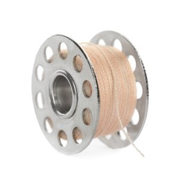 Photo of Metal spool of pale pink sewing thread isolated on white
