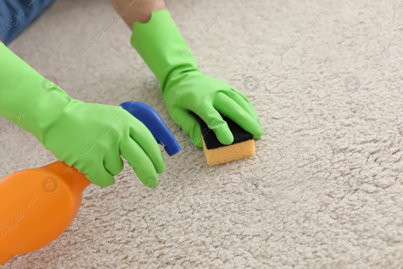 Photo of Man cleaning carpet at home