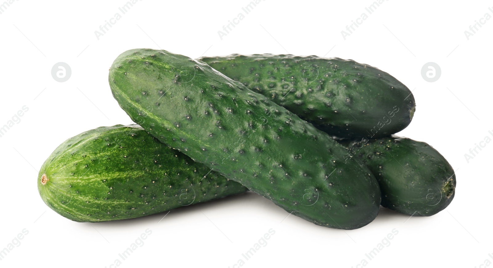 Photo of Whole fresh green cucumbers on white background