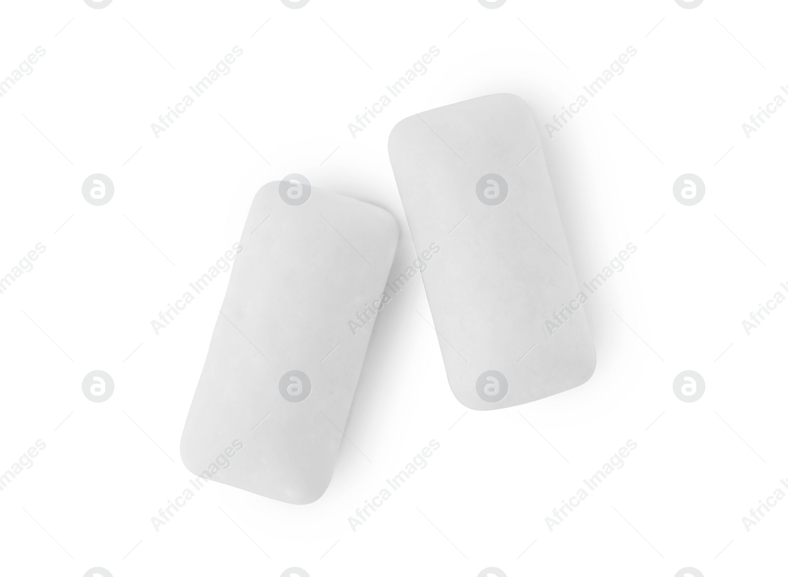 Photo of Tasty chewing gums on white background, top view