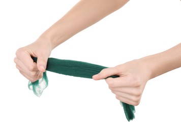 Woman holding teal felting wool on white background, closeup