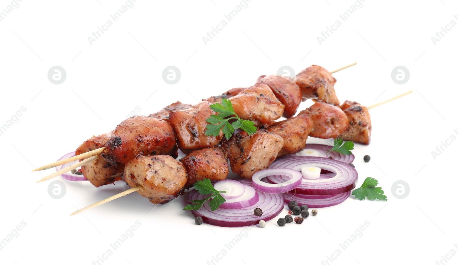 Photo of Delicious shish kebabs with onion, parsley and spices isolated on white